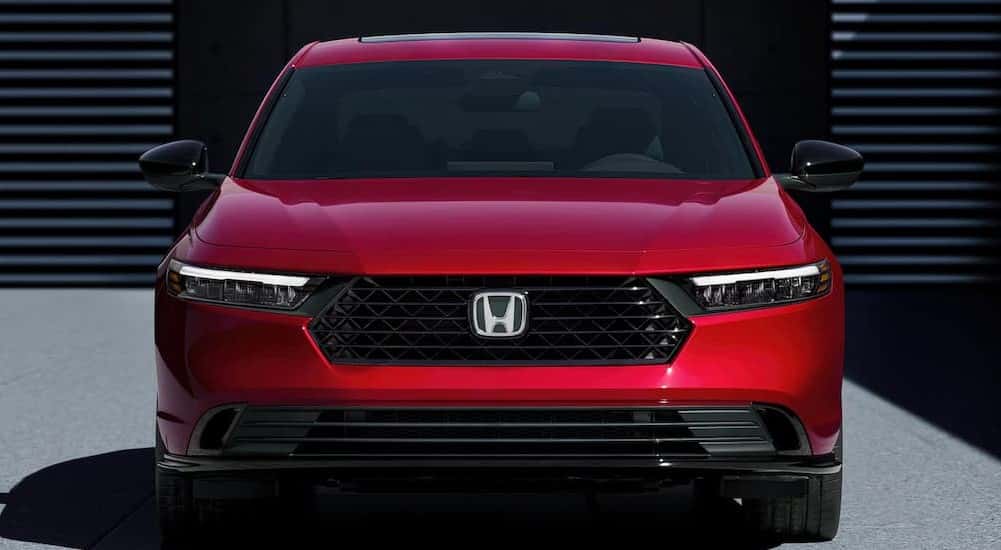 A red 2024 Honda Accord is shown parked after viewing a used Honda Accord for sale.