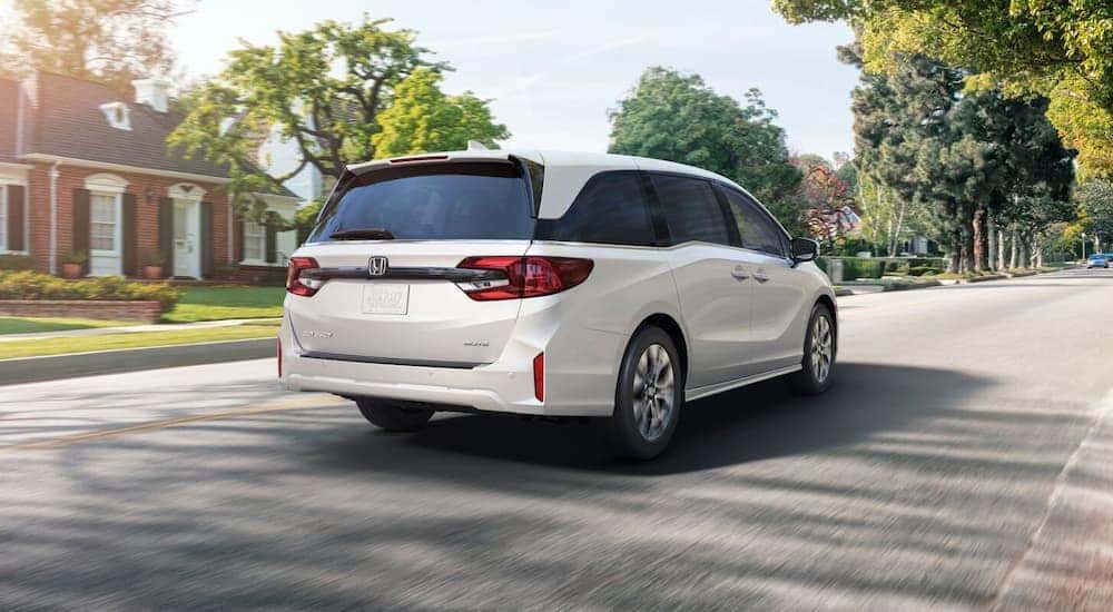 Rear view of a white 2025 Honda Odyssey for sale.