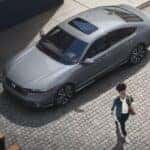 Person walking near a 2025 Honda Accord Hybrid.