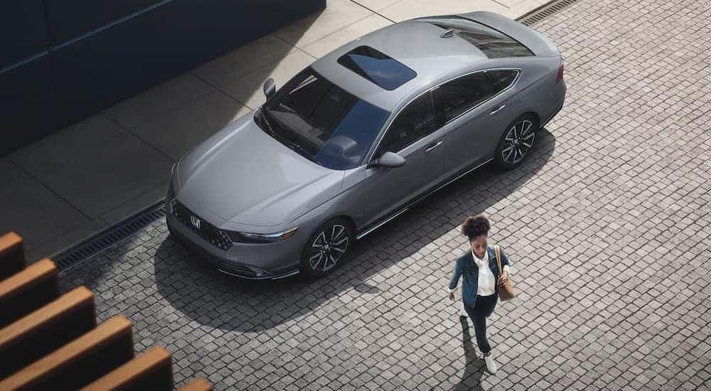 Person walking near a 2025 Honda Accord Hybrid.