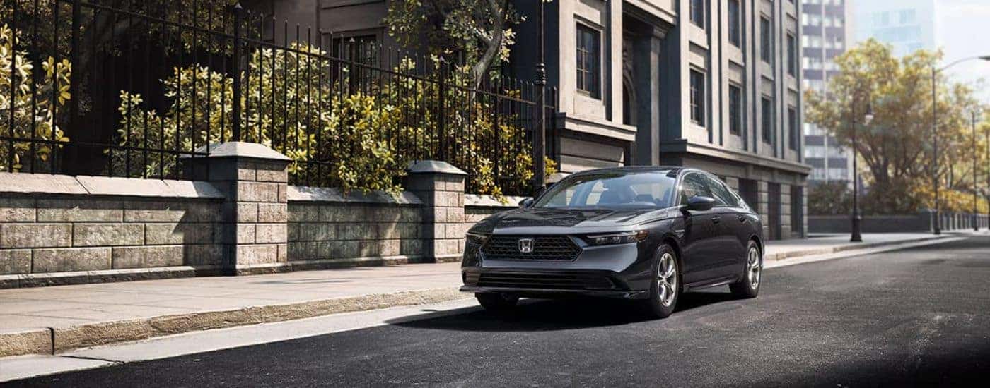 Grey 2023 Honda Accord parked in front of a townhouse
