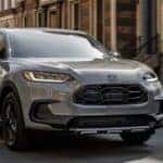 A gray 2025 Honda HR-V Sport driving for sale in Oklahoma City