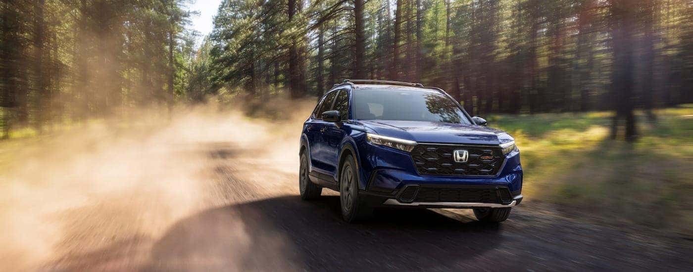 Grey 2026 Honda CR-V driving off-road.