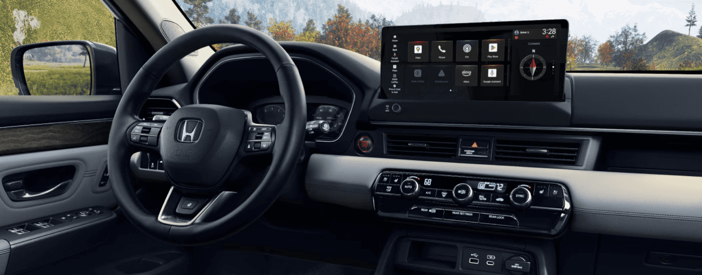 Infotainment and digital gauge cluster on a 2026 Honda Pilot