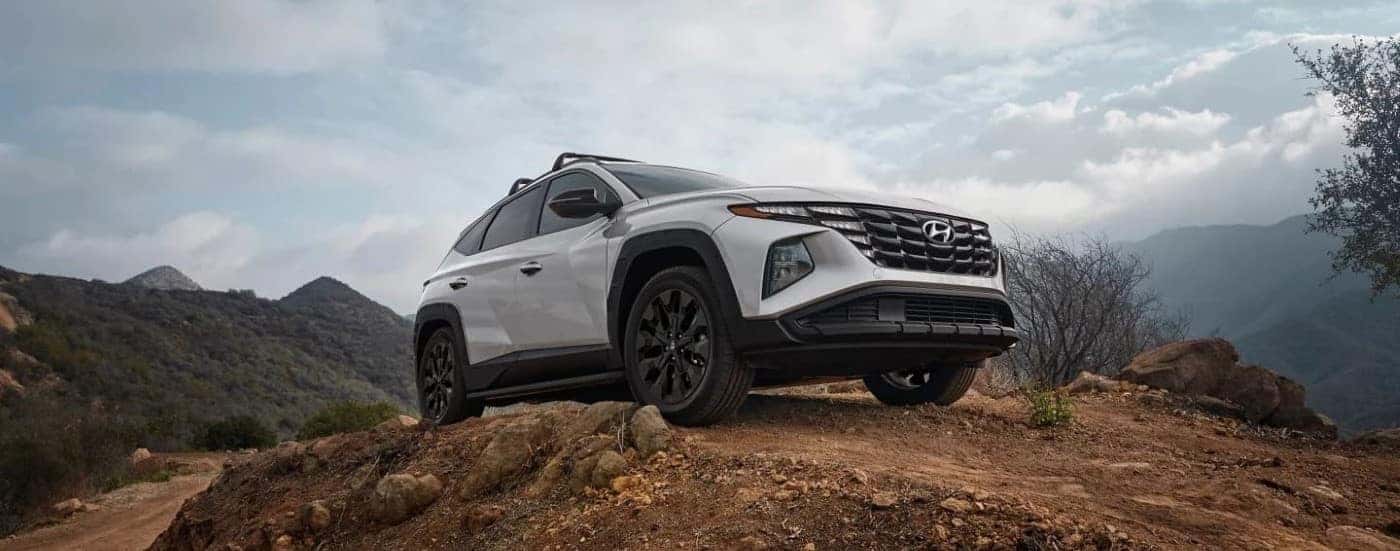 White 2023 Hyundai Tucson XRT parked on a hill after visiting a Hyundai dealer