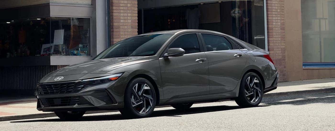 A grey 2025 Hyundai Elantra for sale is shown from the side.