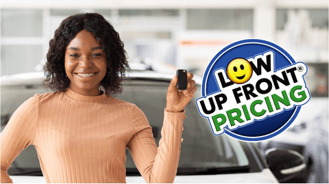 woman holding up Ford keys with a "low up front pricing" phrase displayed inside of a blue circle