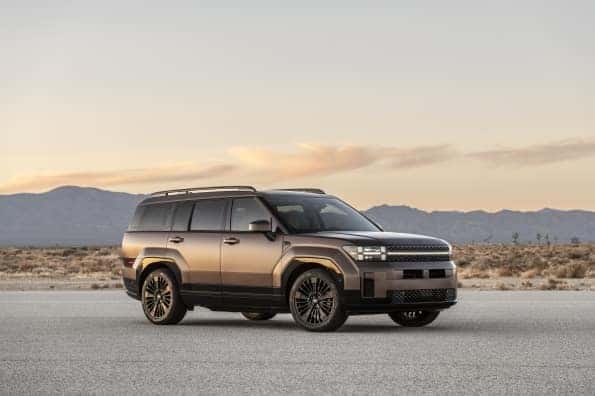 A Santa Fe Hybrid vehicle with a mountain background