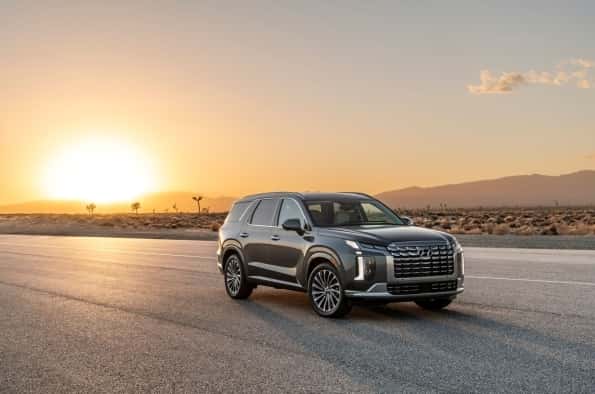 A Hyundai Palisade with a sunset