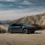 A green Hyundai IONIQ 5 off-roading
