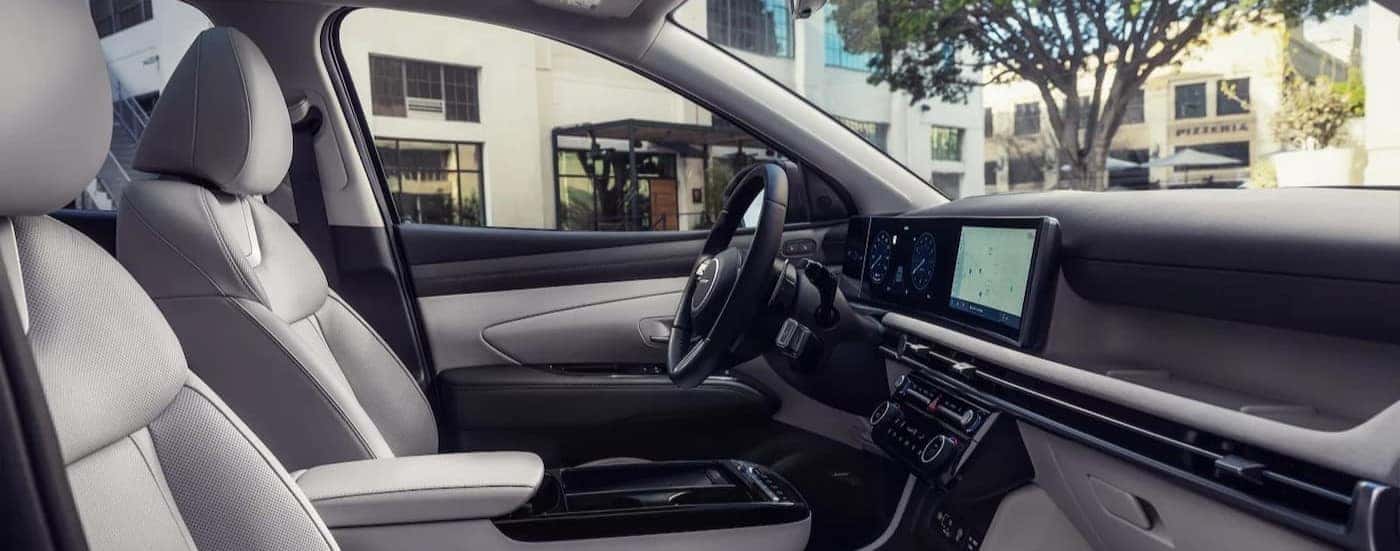 The black and gray interior in a 2025 Hyundai Tucson for sale near Clermont.