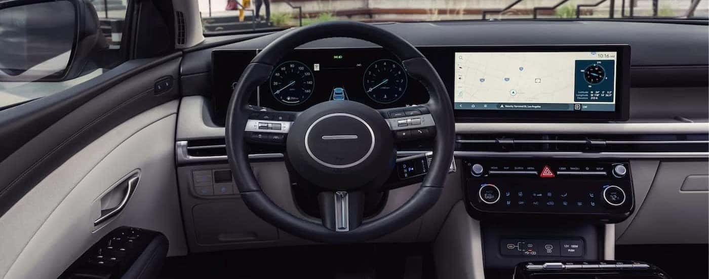 Close-up of the steering wheel and dash in a 2025 Hyundai Tucson for sale near me.