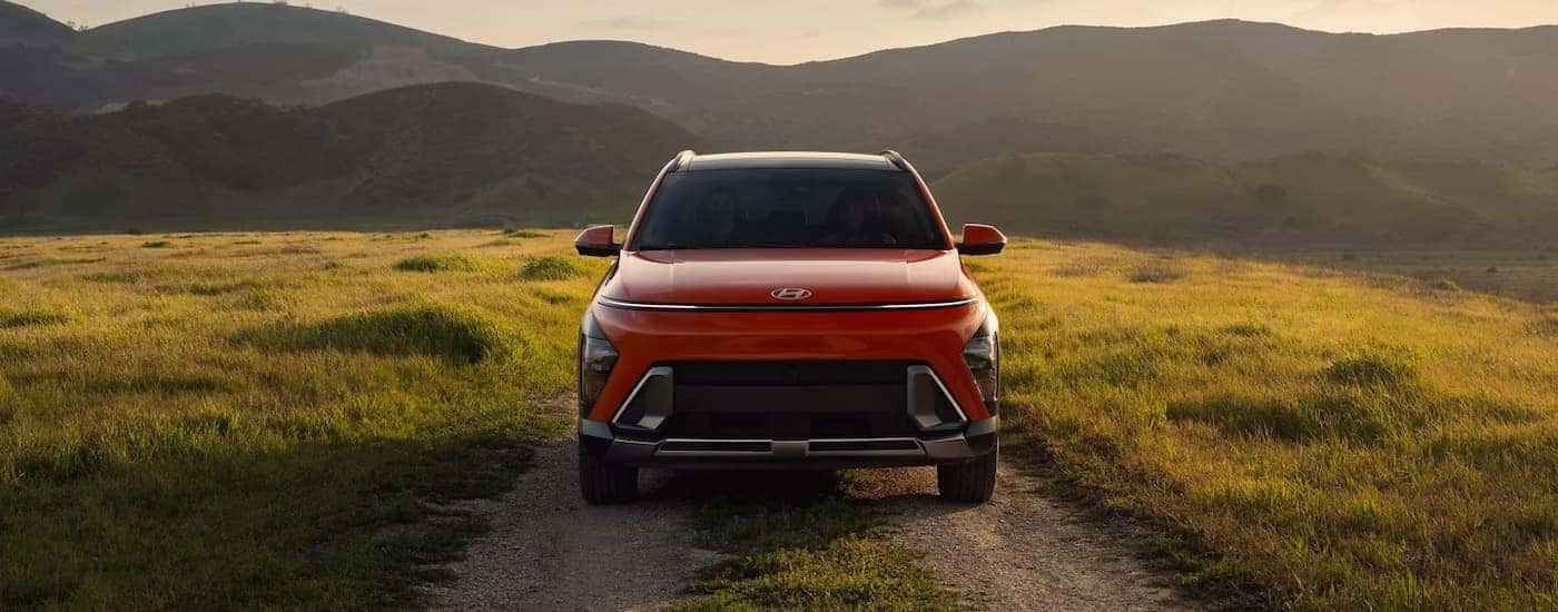 A red 2026 Hyundai Kona driving on an off-road trail