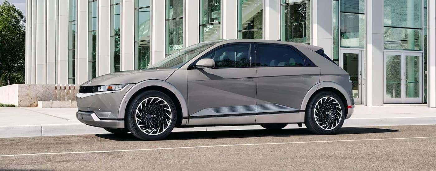 A silver 2023 Hyundai IONIQ 5 parked in a city.