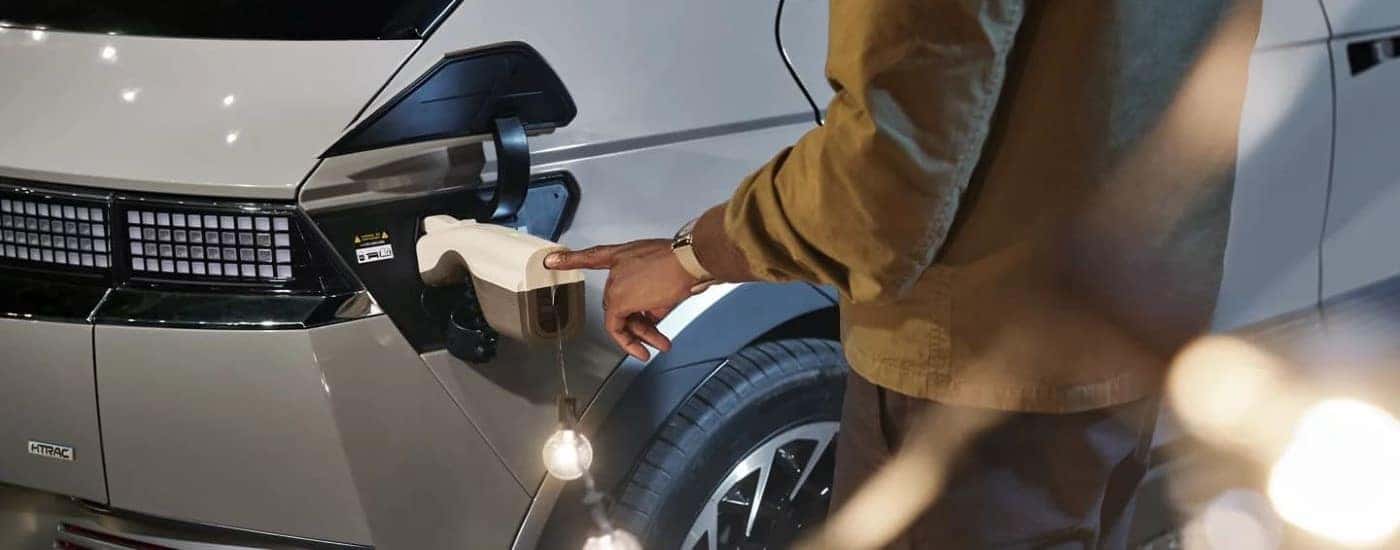 A man plugging in a 2023 Hyundai IONIQ 5 to charge