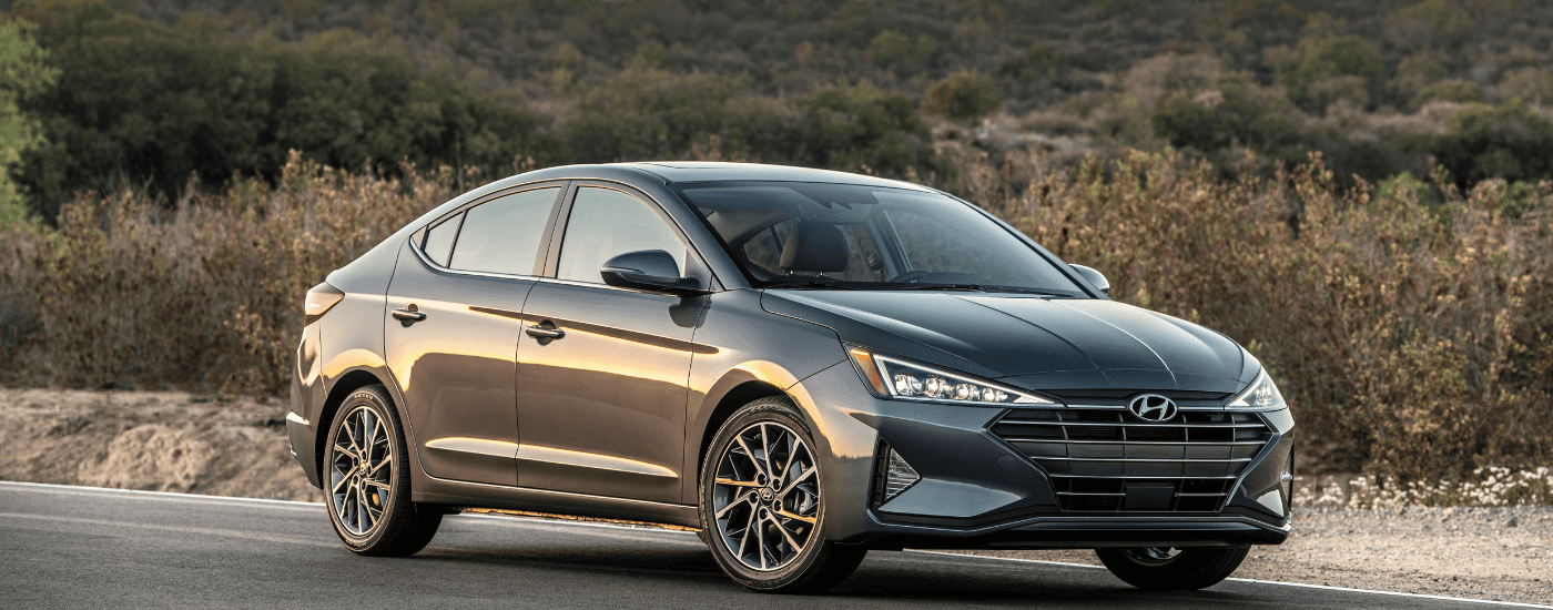 Silver 2019 Hyundai Elantra for sale near Kissimmee from the side