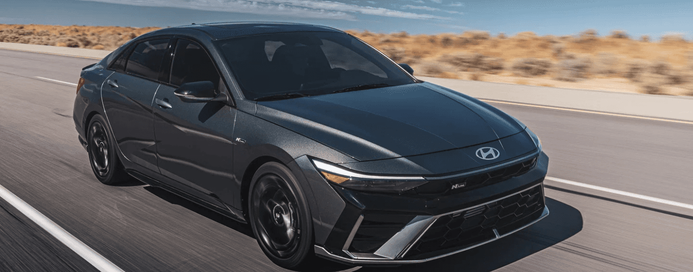 Black 2025 Hyundai Elantra for sale driving down open road