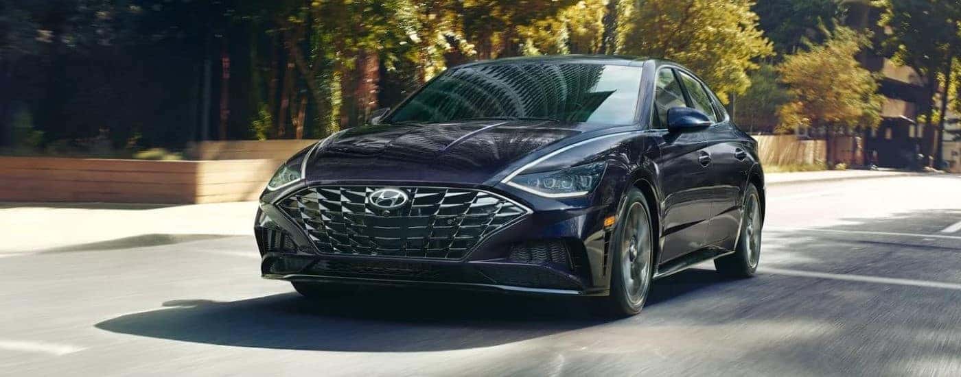 Blue 2023 Hyundai Sonata Limited parked in a driveway