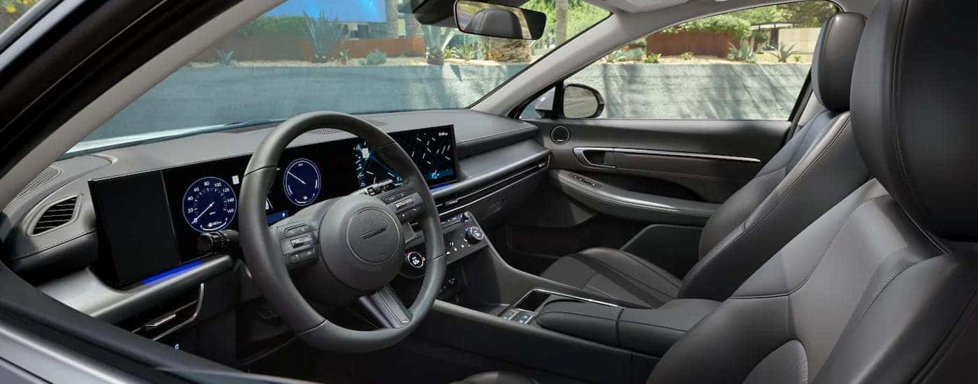 The black interior of a 2026 Hyundai Clermont as seen from the side.