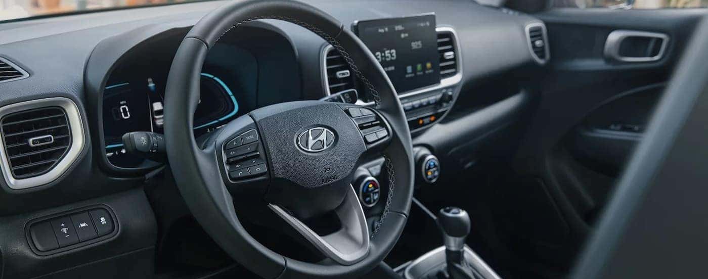 Black dash in a 2026 Hyundai Venue for sale.