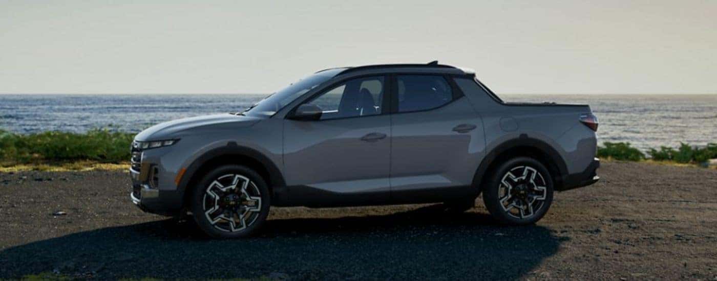 A gray 2026 Hyundai Santa Cruz shown parked on a beach.