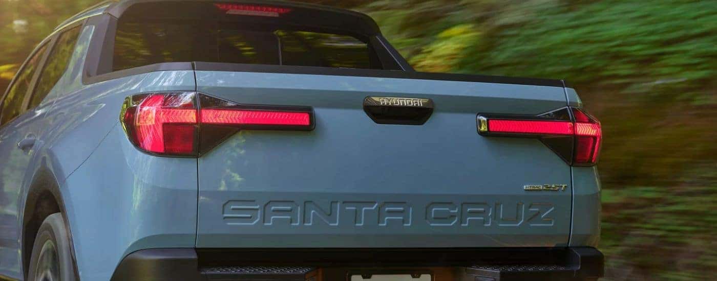 Rearview of a blue 2026 Hyundai Santa Cruz.