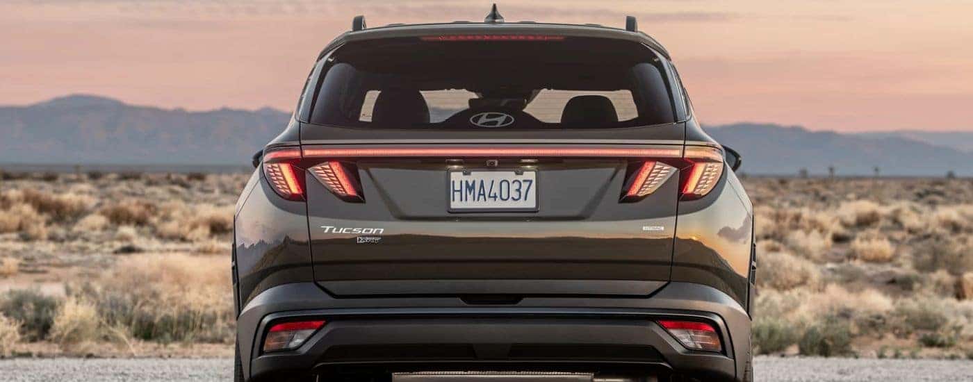 Black 2026 Hyundai Tucson XRT rear view in the desert.