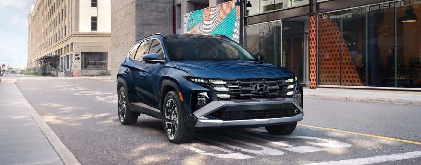 Blue 2026 Hyundai Tucson stopped won the street.