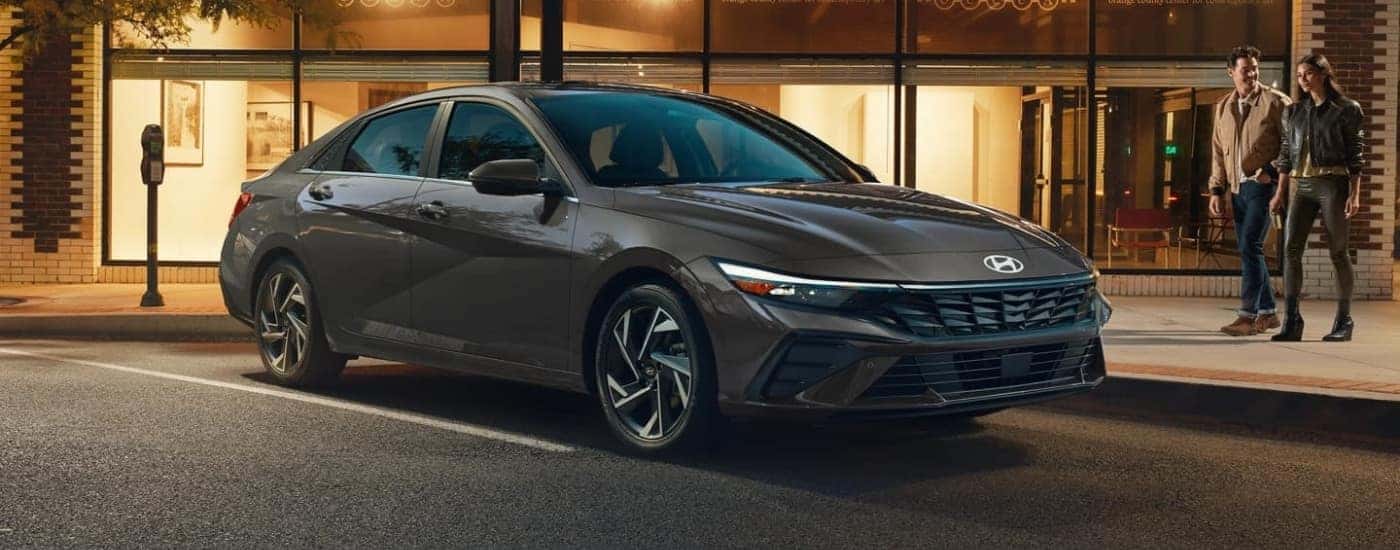 Grey 2026 Hyundai Elantra Hybrid Limited parked outside of an art center