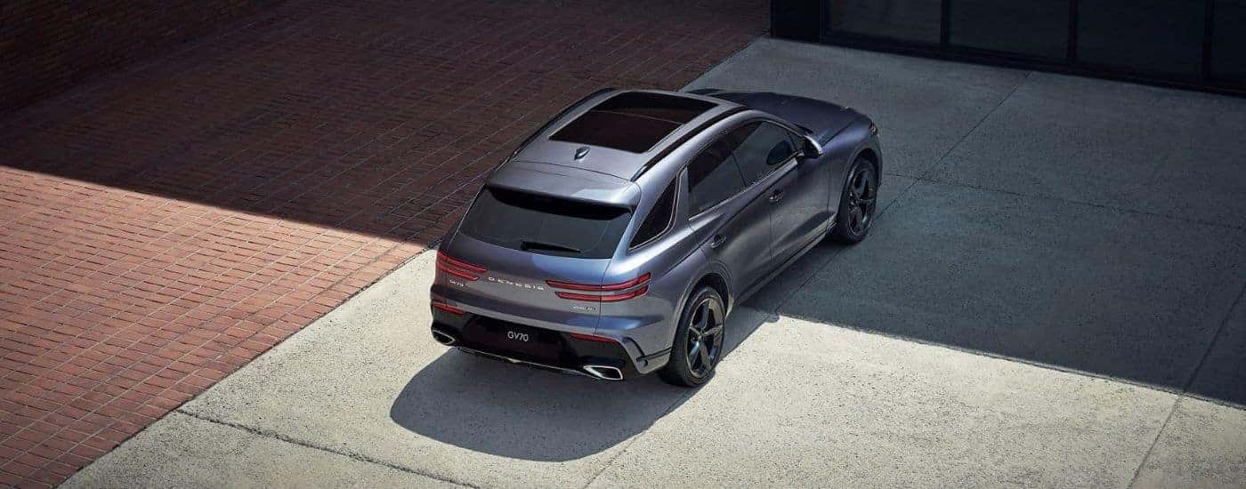 Rear birds-eye view of a gray 2025 Genesis GV70.