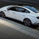 Aerial view of a white 2024 Hyundai Sonata N-Line parked in a city.