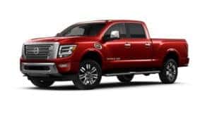 A red 2021 Nissan Titan XD angled left