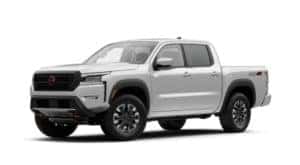 A white 2022 Nissan Frontier is angled left.