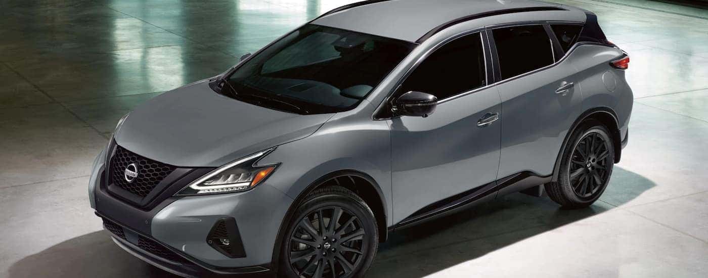 Silver 2022 Nissan Murano parked in a modern gallery