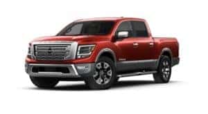 A red 2023 Nissan Titan is angled left.
