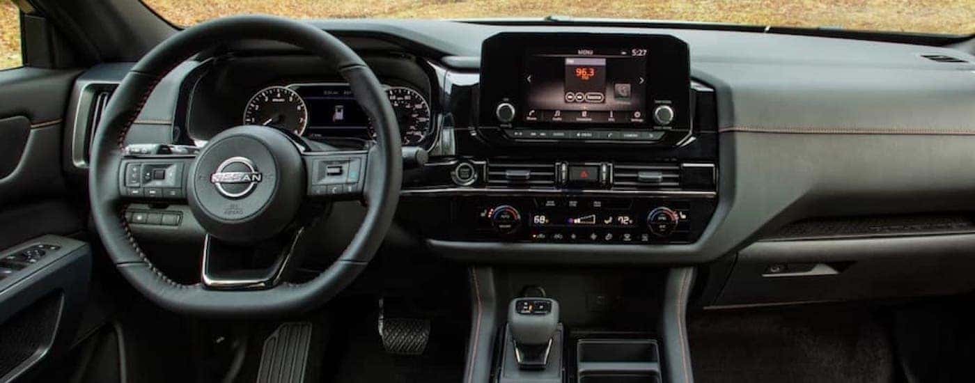 The dash of a 2023 Nissan Pathfinder Rock Creek is shown from the center console.
