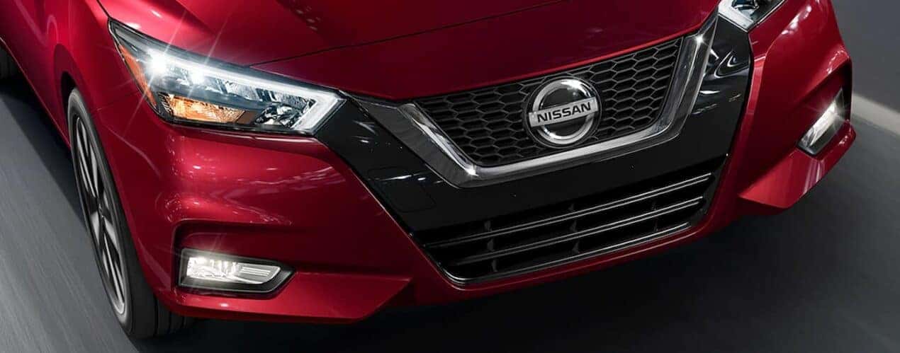 Close-up of the frontend on a red 2023 Nissan Sentra