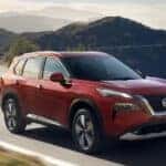 A red 2023 Nissan Rogue is shown from the front at an angle.
