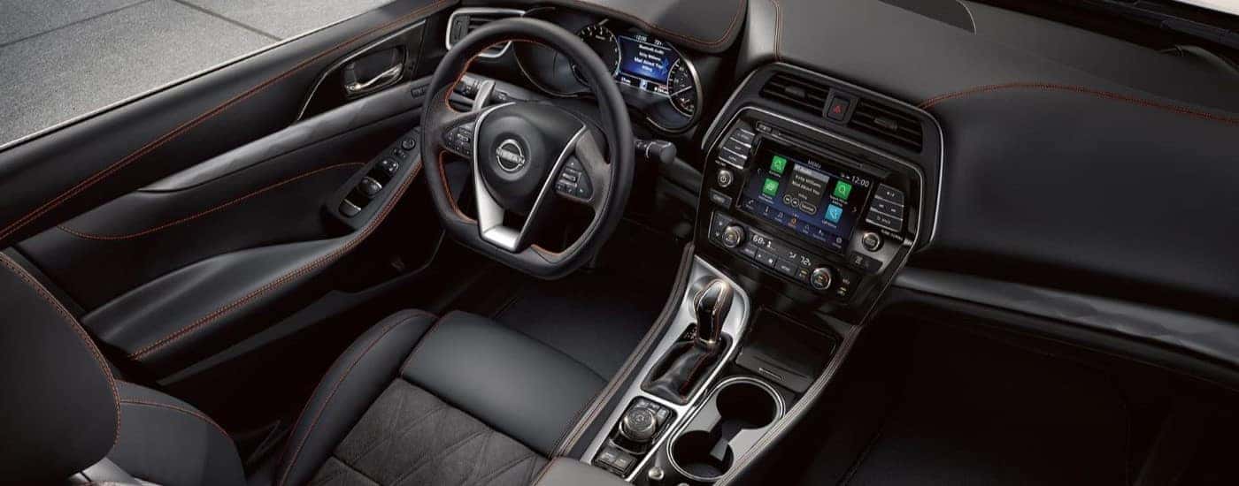 The black interior is shown from a high angle in a 2023 Nissan Maxima for sale.