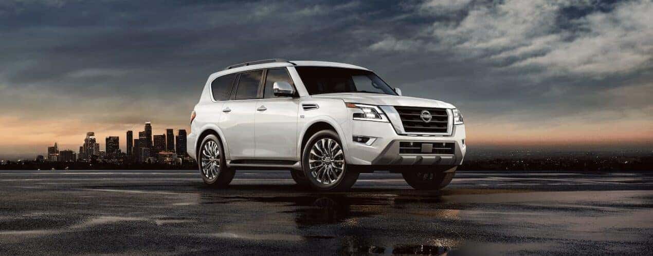 A white 2023 Nissan Armada Platinum is shown parked during a 2023 Nissan Armada vs 2023 Chevy Tahoe comparison.