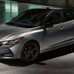 A silver 2023 Nissan Sentra Midnight Edition is shown parked in a hangar.