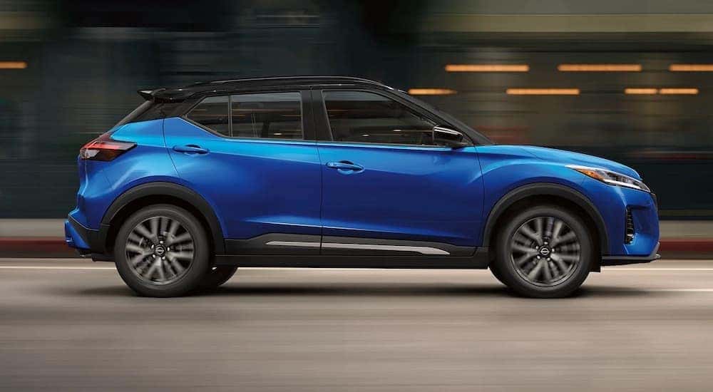 A blue 2022 Nissan Kicks is shown from the side.