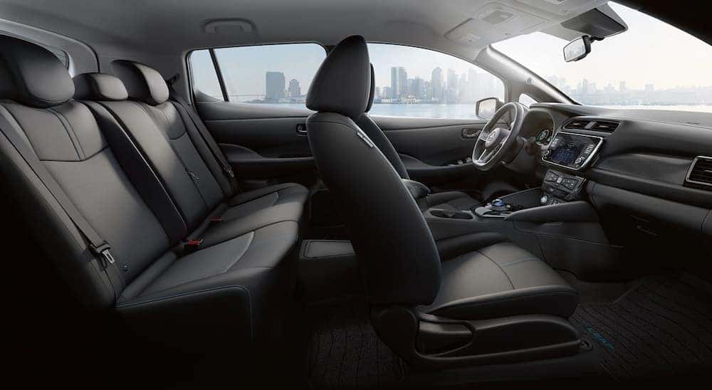 The black interior and dash in a 2024 Nissan LEAF SV is shown.
