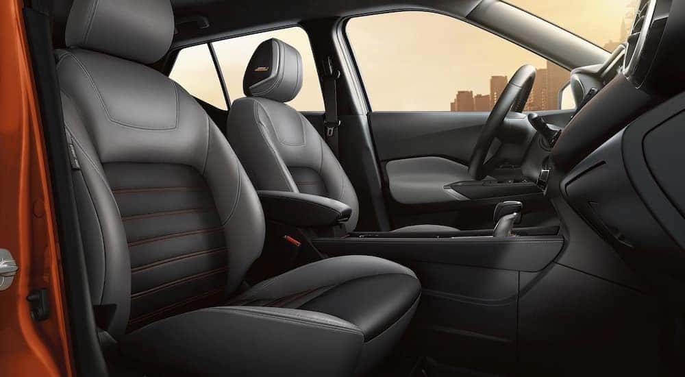 The black interior of a 2024 Nissan Kicks SV is shown.