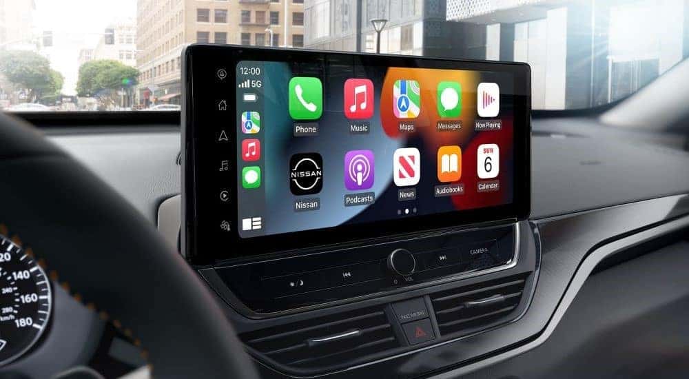 The infotainment screen in the interior of a 2024 Nissan Altima is shown.