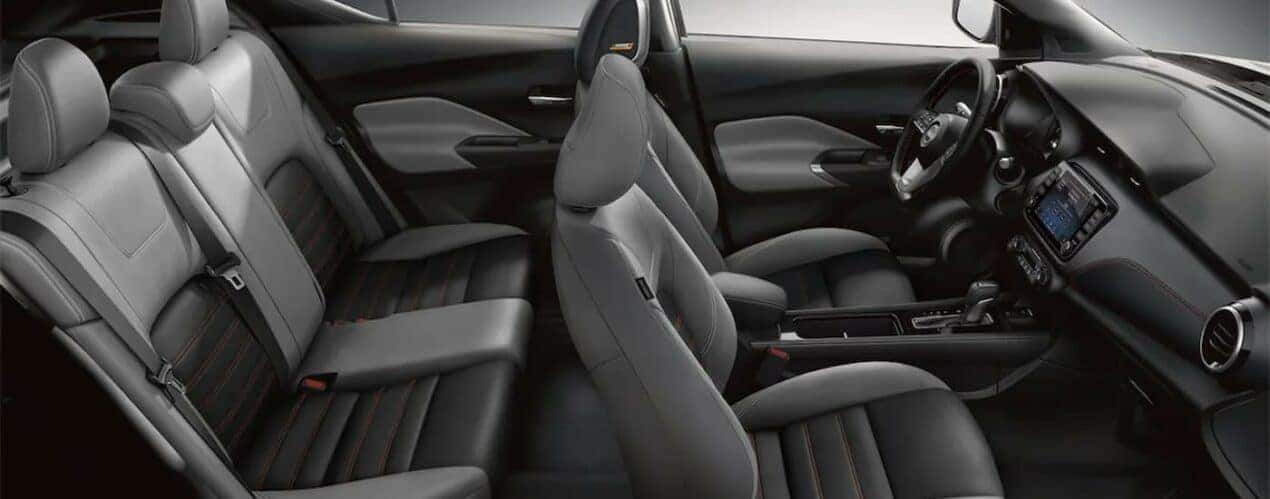 The black and gray interior and dash in a 2024 Nissan Kicks is shown.