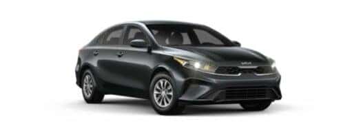 A black 2024 Kia Forte is angled right.