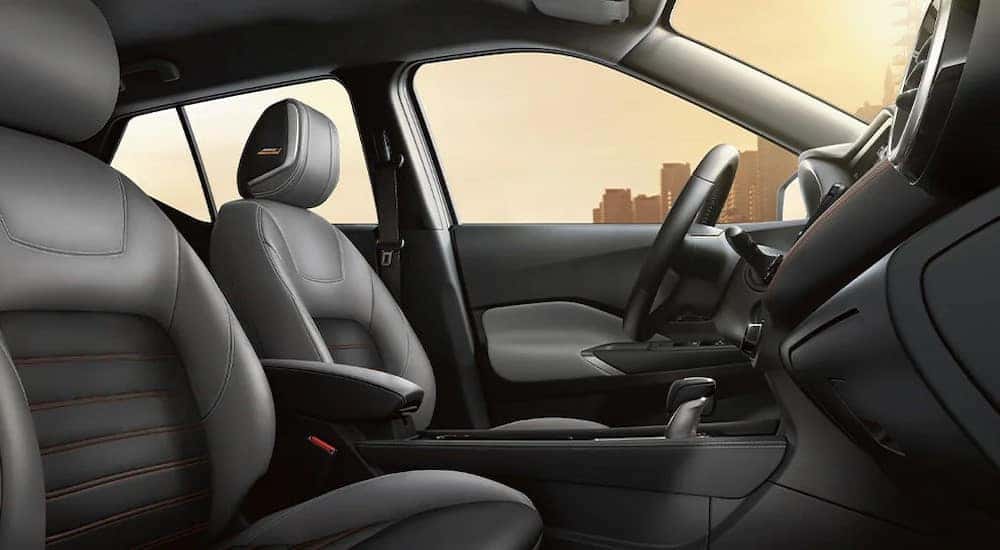 The black and gray interior in a 2024 Nissan Kicks is shown.