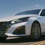 A white 2024 Nissan Altima SR is shown from the front at an angle.