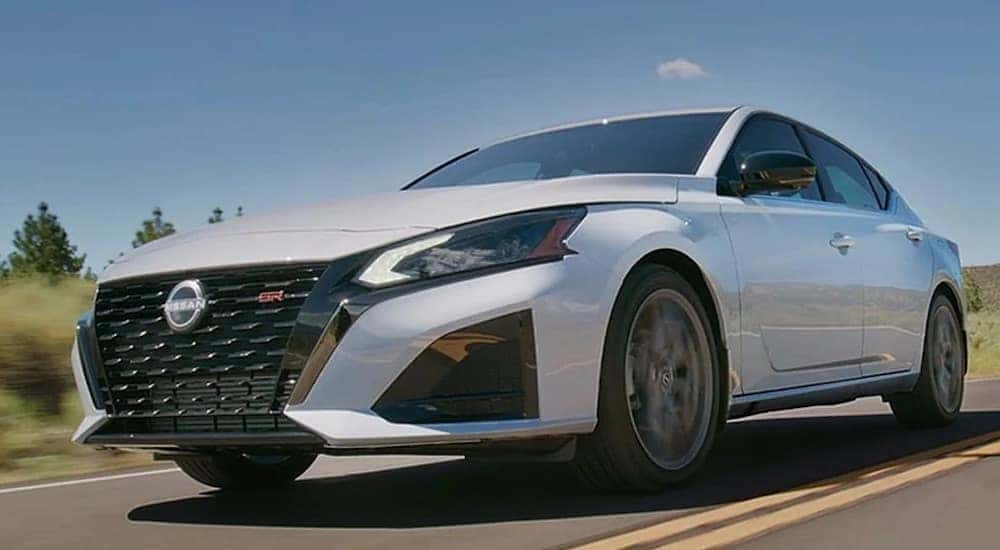 A white 2024 Nissan Altima SR is shown from the front at an angle.